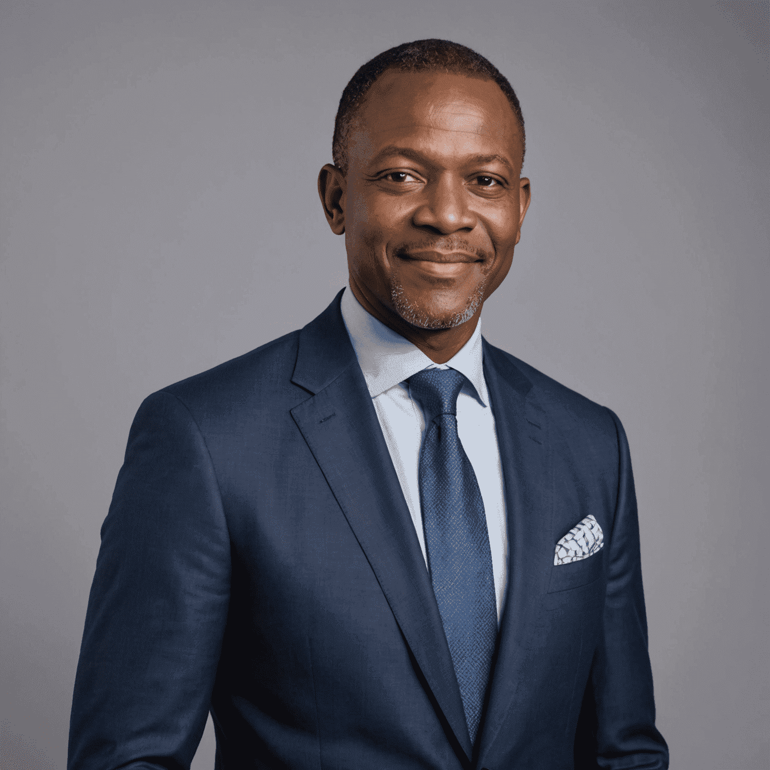 Portrait of the founder and CEO of StrategyAfrica, a middle-aged man in a suit with a confident and friendly expression